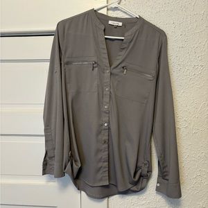 Long sleeve steel grey Calvin Klein blouse with silver detailing.